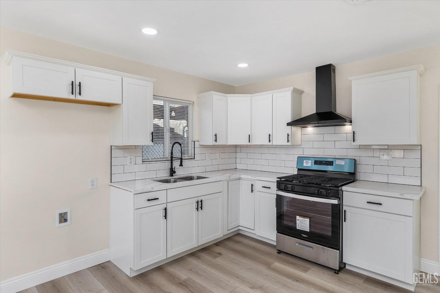 Undisclosed Address Bakersfield, CA 93312 - Photo 12 of 23 a kitchen with stainless steel appliances granite countertop a stove and a sink