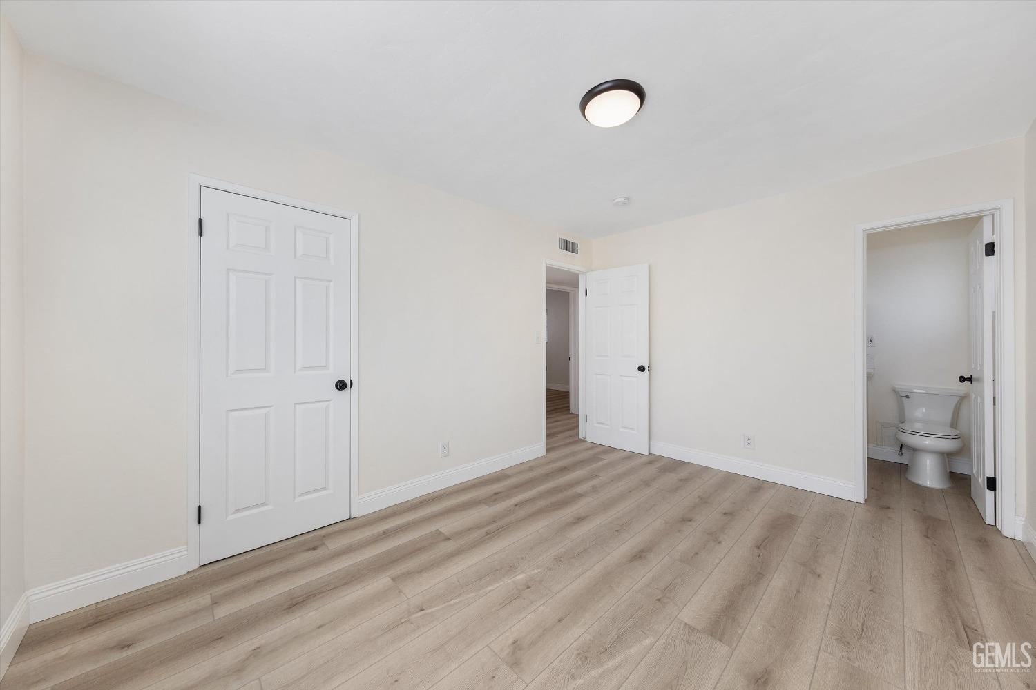 Undisclosed Address Bakersfield, CA 93312 - Photo 16 of 23 a view of empty room with wooden floor