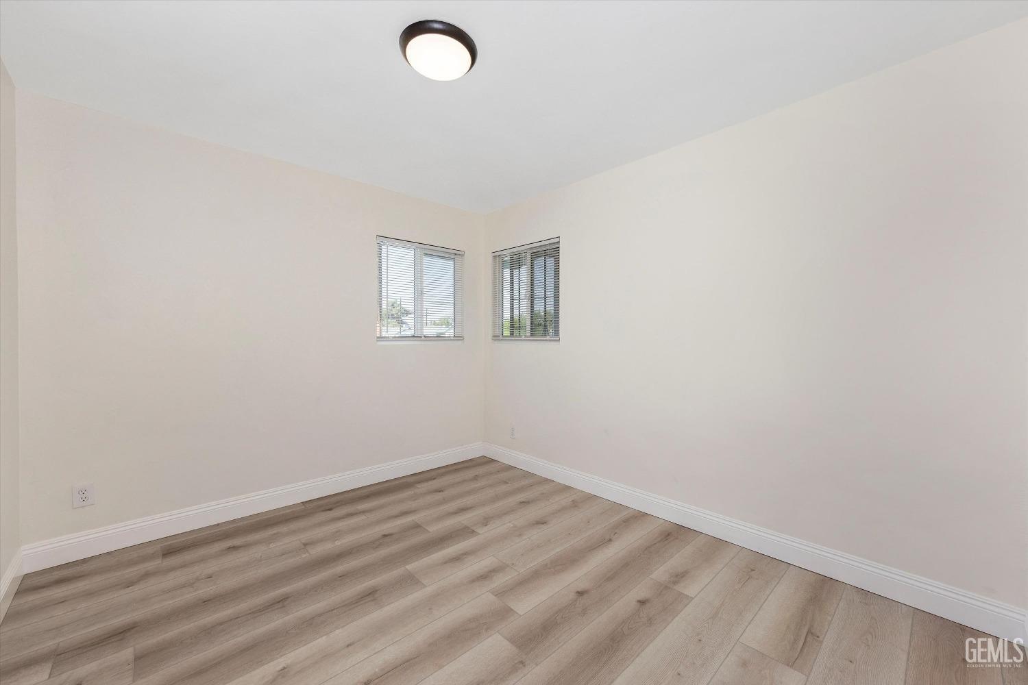Undisclosed Address Bakersfield, CA 93312 - Photo 21 of 23 an empty room with a workbench