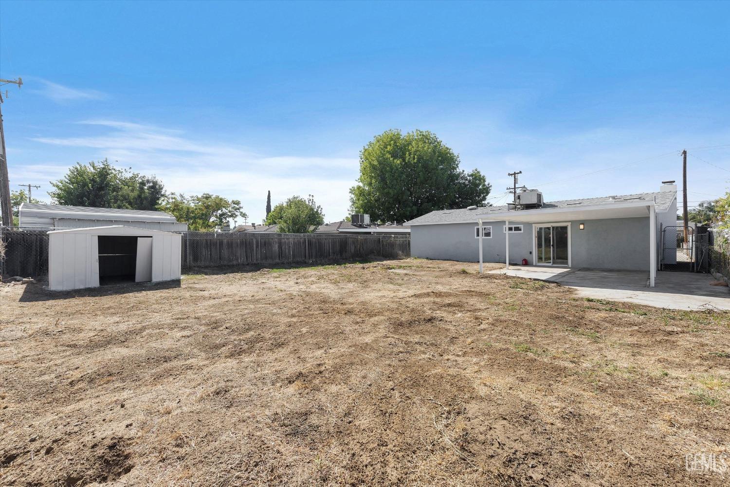 Undisclosed Address Bakersfield, CA 93312 - Photo 23 of 23 a backyard of a house with table and sofas