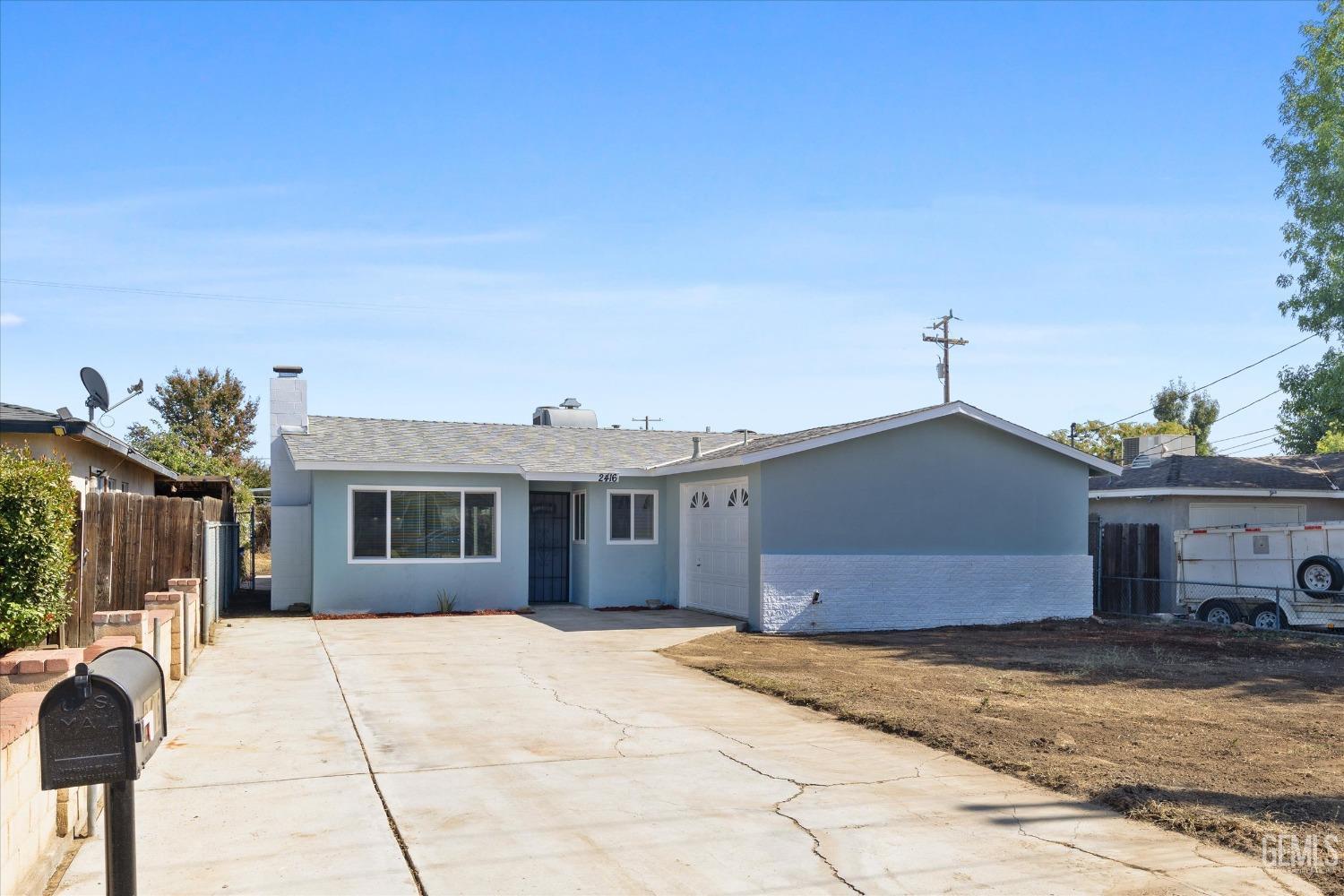 Undisclosed Address Bakersfield, CA 93312 - Photo 3 of 23 a front view of a house with a yard