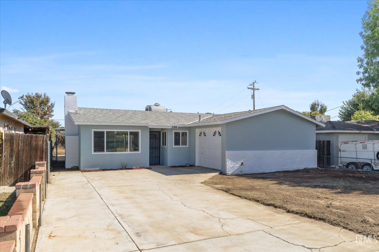 Undisclosed Address Bakersfield, CA 93312 - Photo 4 of 23 a front view of a house with a yard