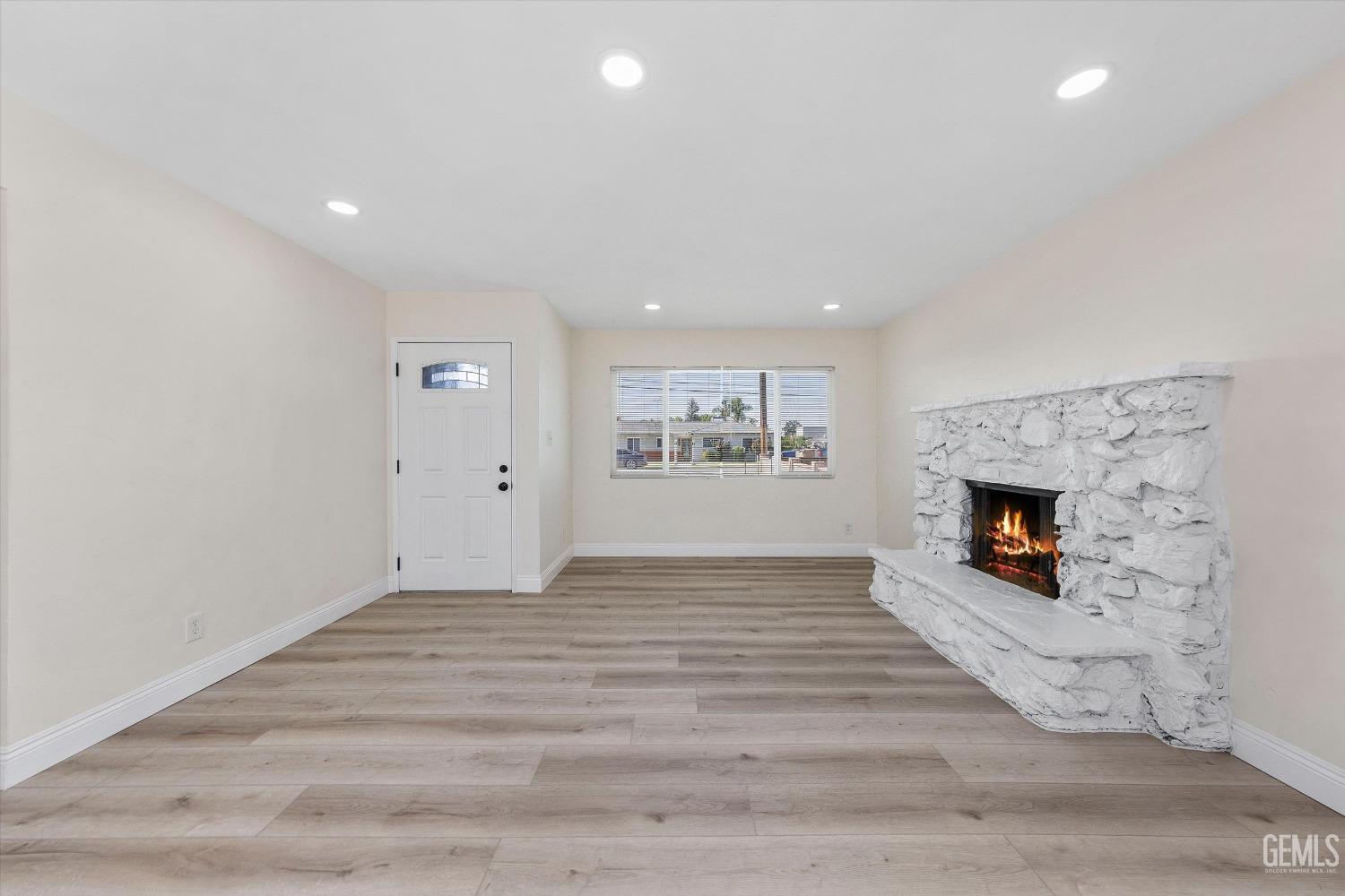 Undisclosed Address Bakersfield, CA 93312 - Photo 7 of 23 a view of an empty room and fire place