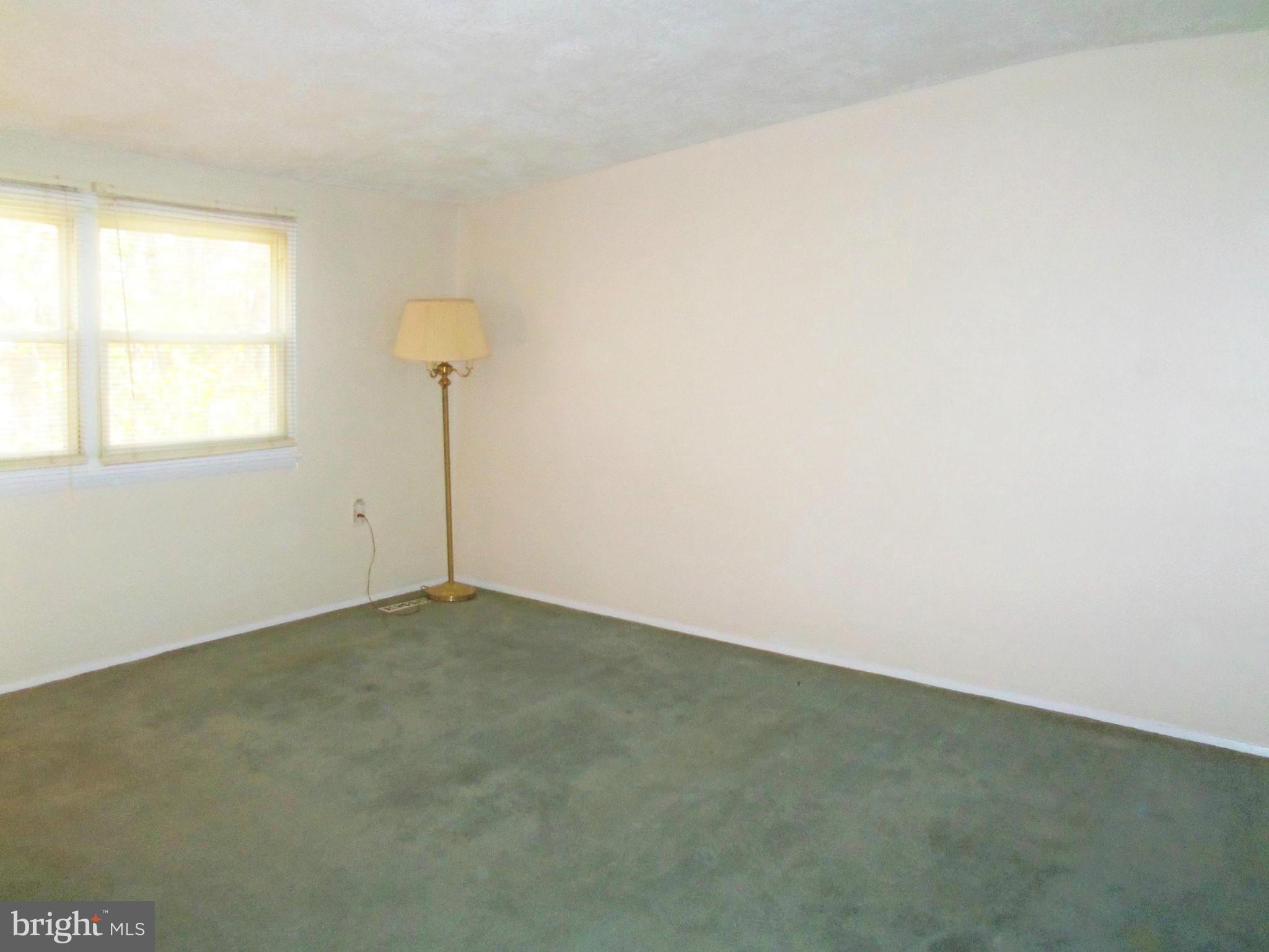 1920 Brookdale Road Baltimore, MD 21244 - Photo 17 of 22 an empty room with a window