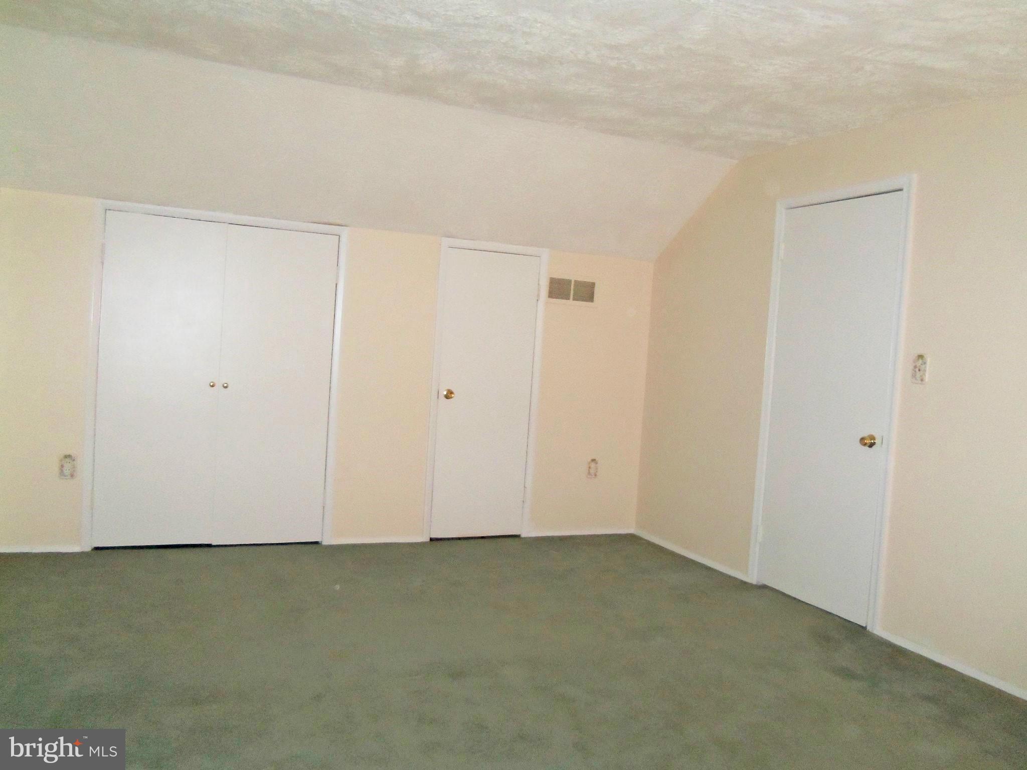 1920 Brookdale Road Baltimore, MD 21244 - Photo 18 of 22 an empty room with wooden floor