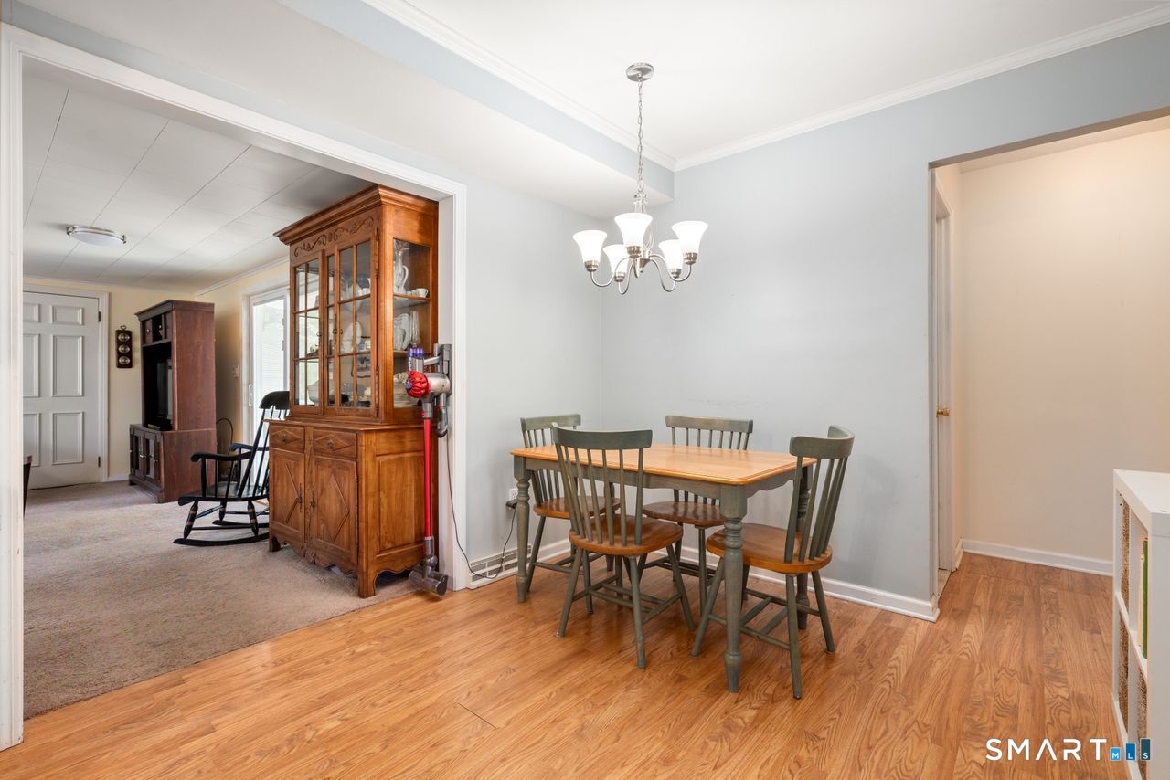 9 Stanton Road North Haven, CT 06473 - Photo 10 of 35 a view of a dining room with furniture and wooden floor