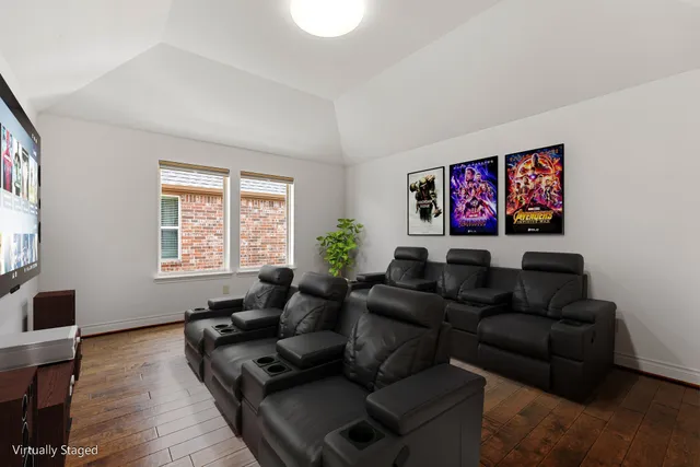 a living room with furniture window and wooden floor