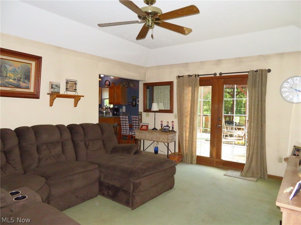 45295 Parsons Road Oberlin, OH 44074 - Photo 11 of 39 Nice size living room with french doors leading out to the rear deck & backyard, has a Tray ceiling, and ceiling fan