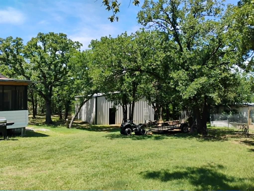 763 Frontier Street Bowie, TX 76230 - Photo 28 of 28 a view of a park with large trees
