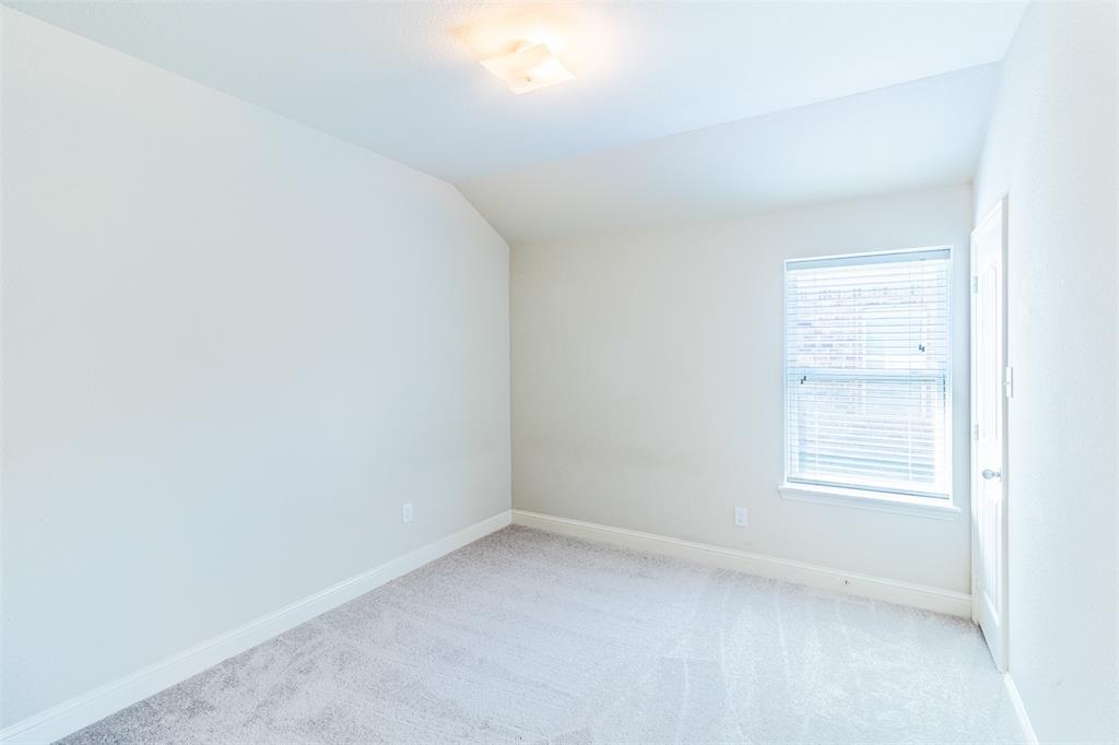 516 Hunt Farms Road Fate, TX 75189 - Photo 31 of 40 bedroom#2 Carpeted flooring, window with blinds, ceiling-mounted light fixture, white walls, and a white door