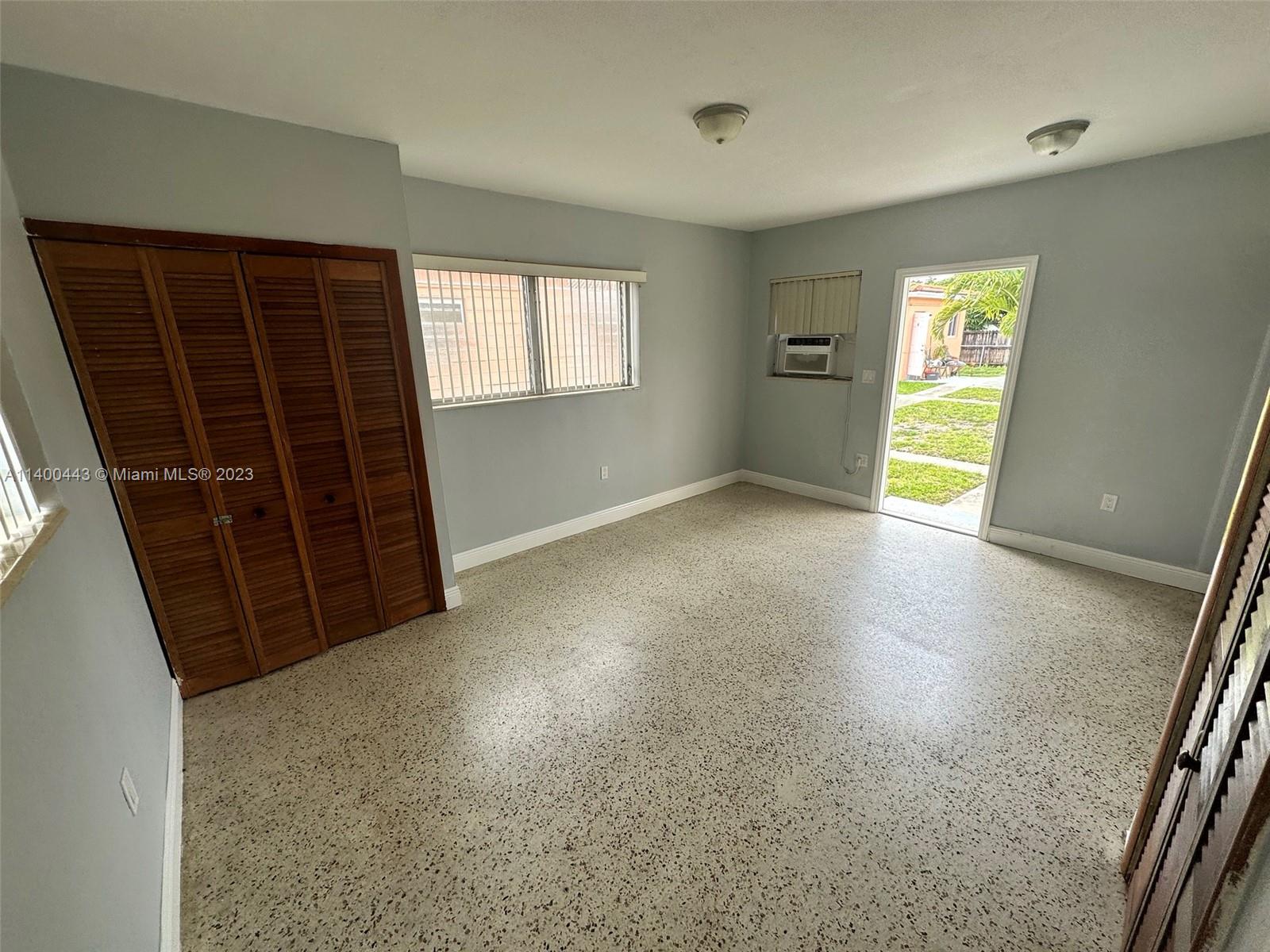 West Flagler Miami, FL 33125 - Photo 12 of 14 an empty room with windows