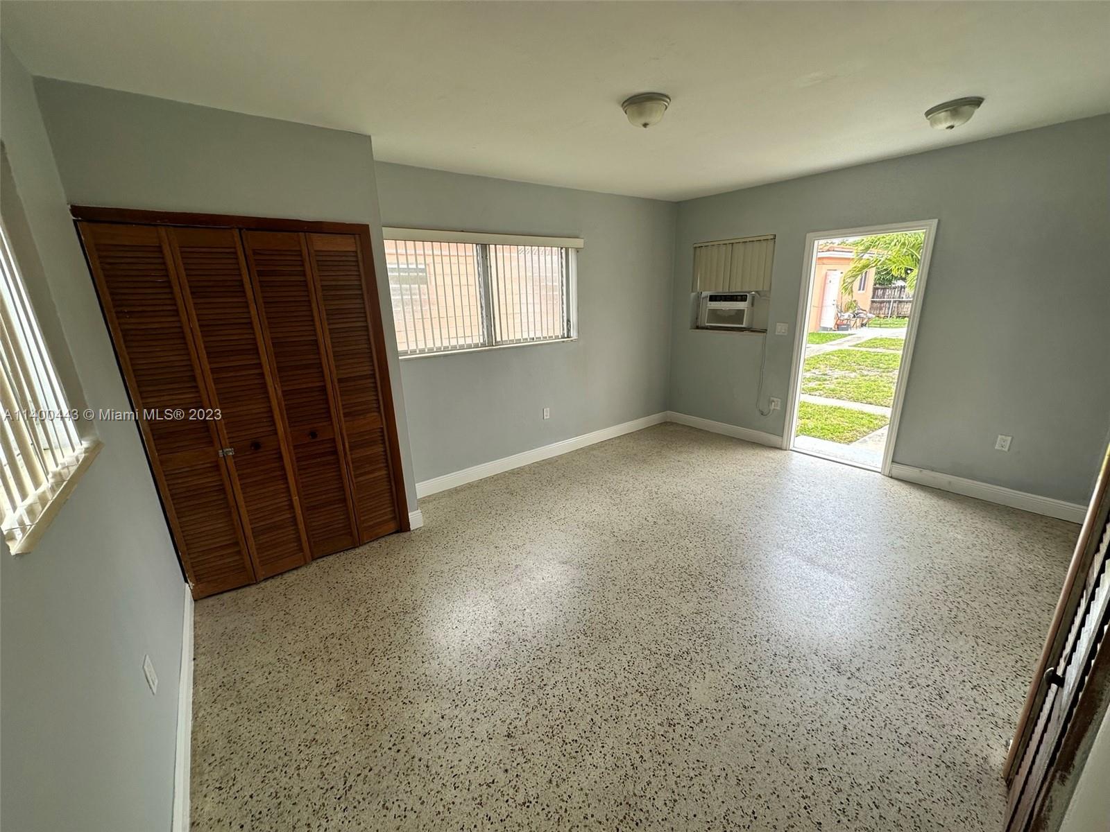 West Flagler Miami, FL 33125 - Photo 6 of 14 an empty room with windows