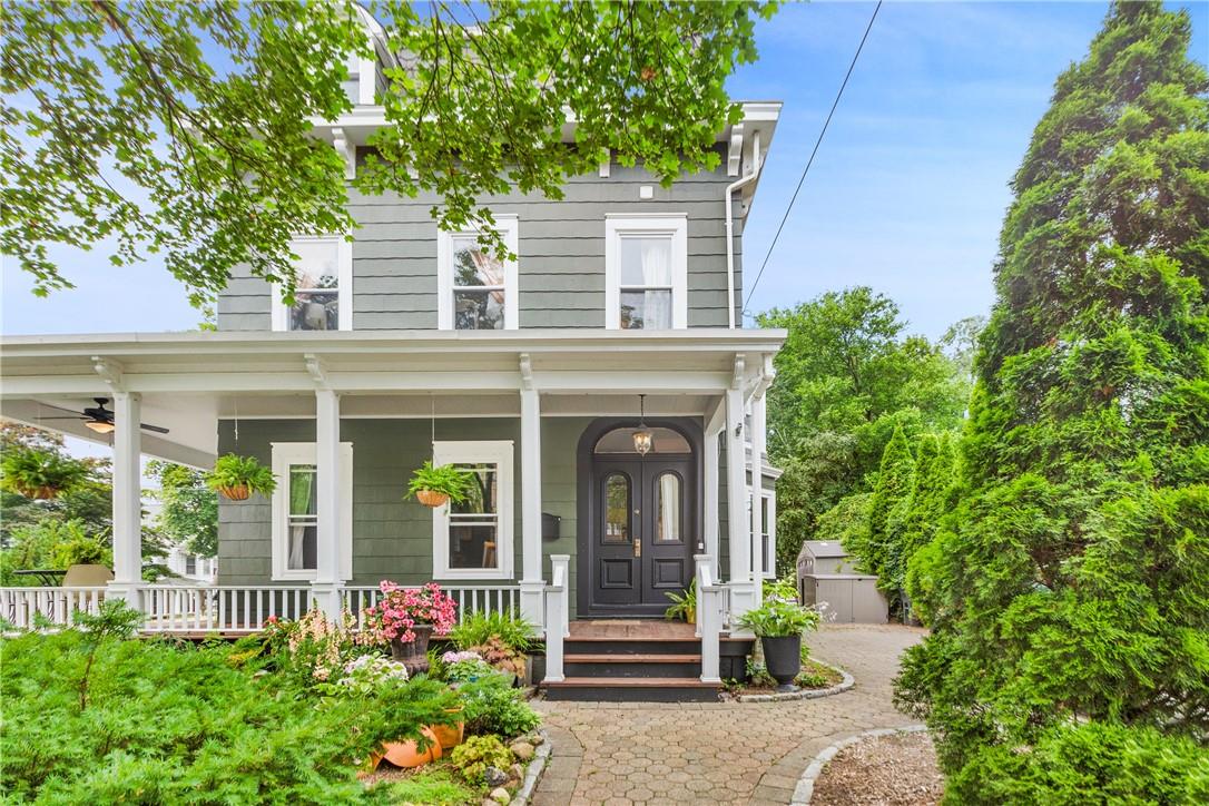 front view of a house with potted plants