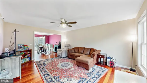a living room with furniture and a rug