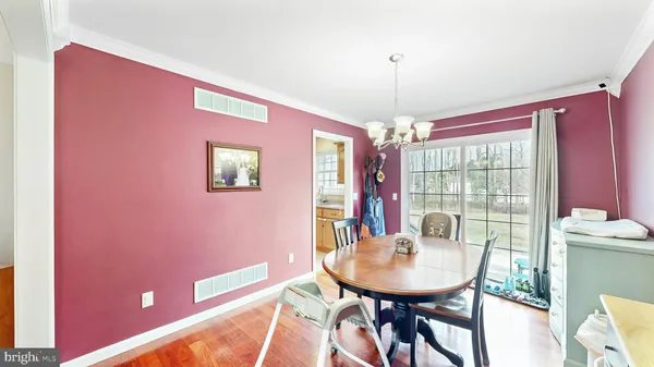 a view of a dining room with furniture and window
