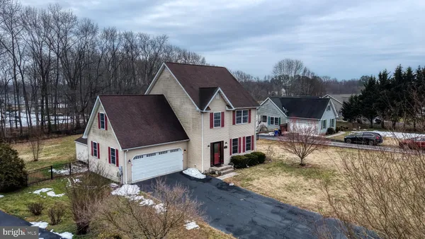 a aerial view of a house with swimming pool and sitting area