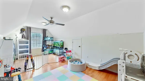 a very nice looking room with a dining table and a potted plant