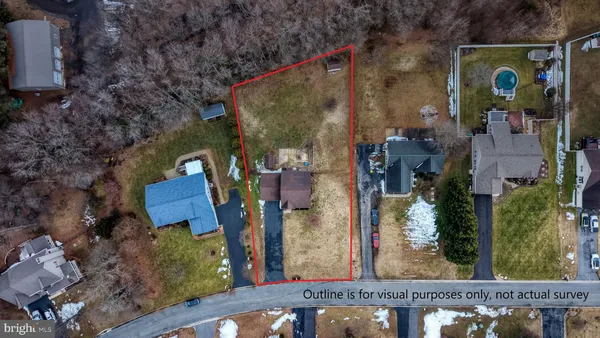 a car parked in front of white house