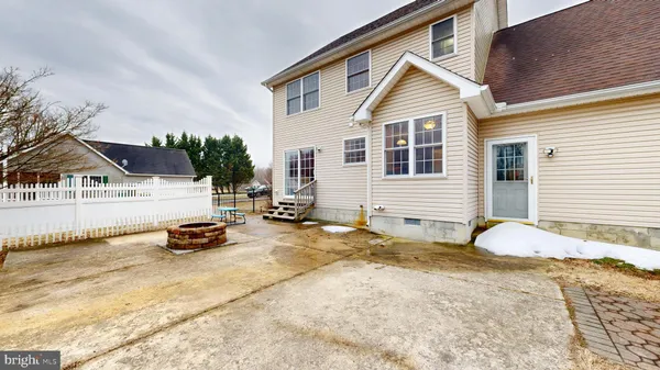 a aerial view of a house with swimming pool and sitting area