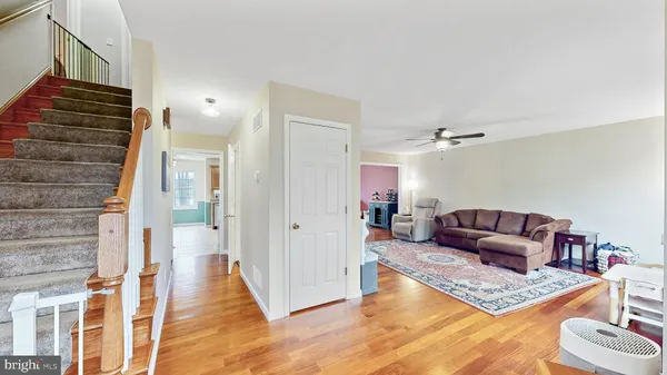 a living room with furniture and a rug