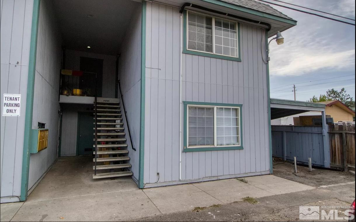 a view of a house with wooden floor and stairs