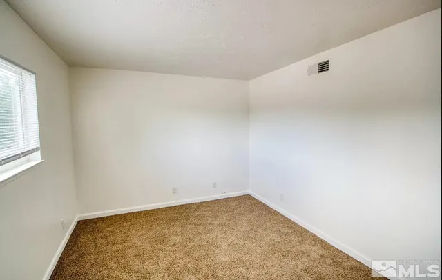 a white toilet sitting next to a bath tub and a shower
