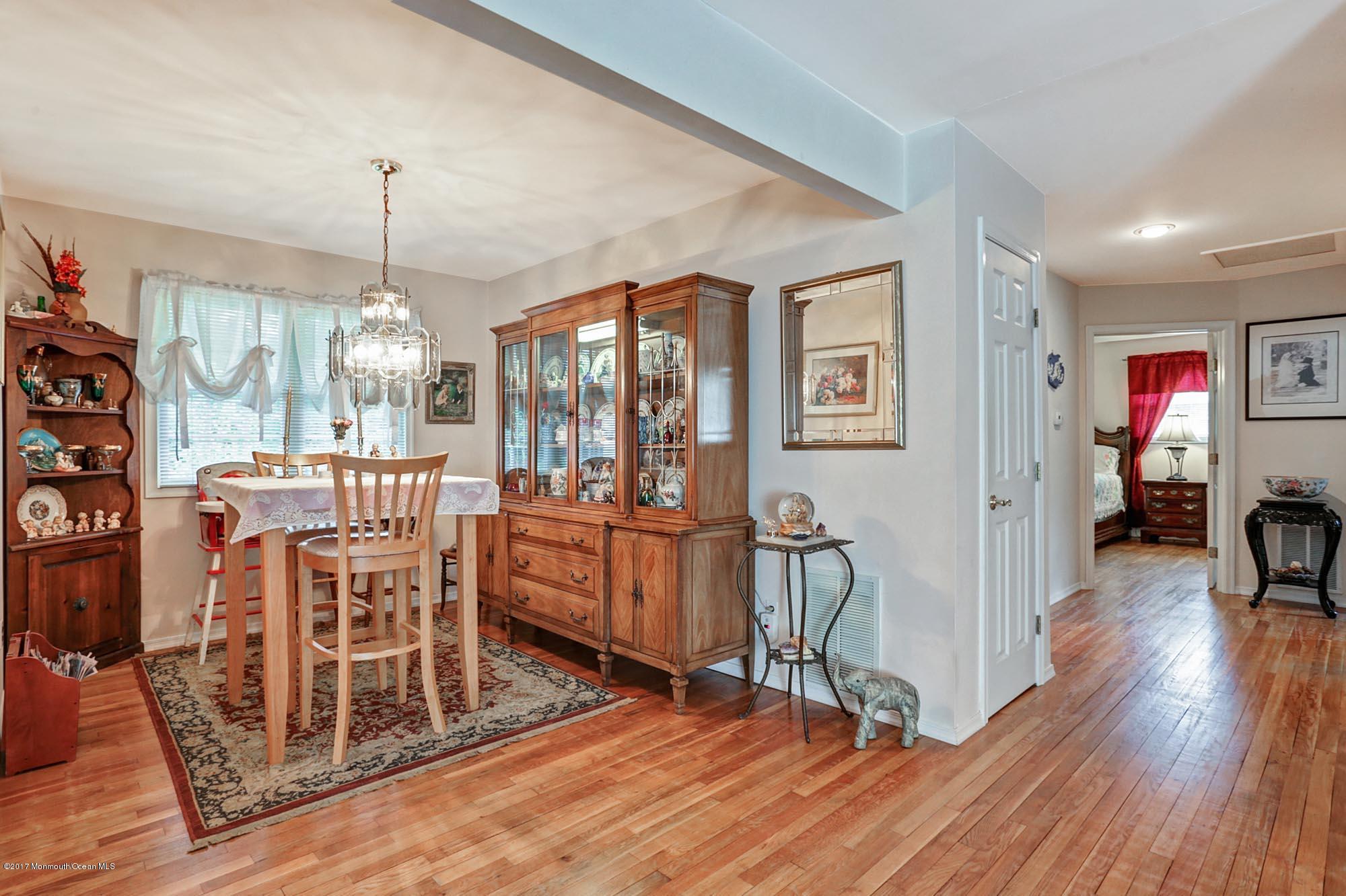 67 Newbury Road Howell, NJ 07731 - Photo 17 of 31 a view of a dining room with furniture window and wooden floor