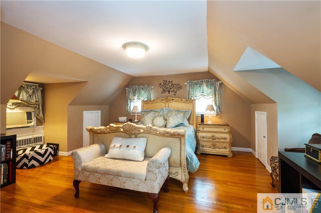 555 Chain O' Hills Road Colonia, NJ 07067 - Photo 11 of 18 a living room with furniture and a wooden floor