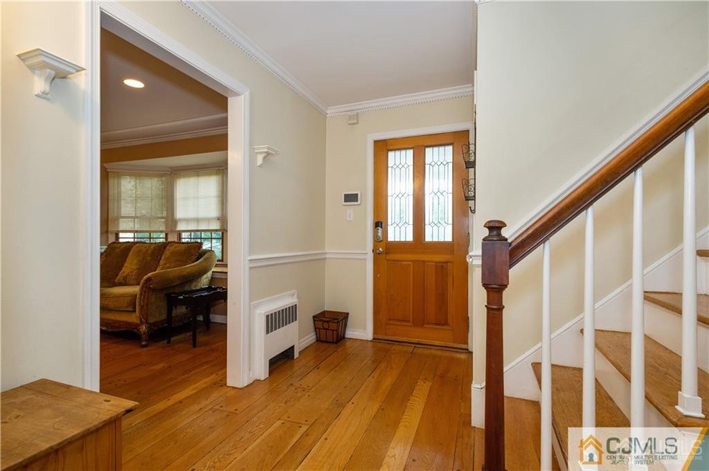 555 Chain O' Hills Road Colonia, NJ 07067 - Photo 3 of 18 a view of hallway with livingroom and furniture