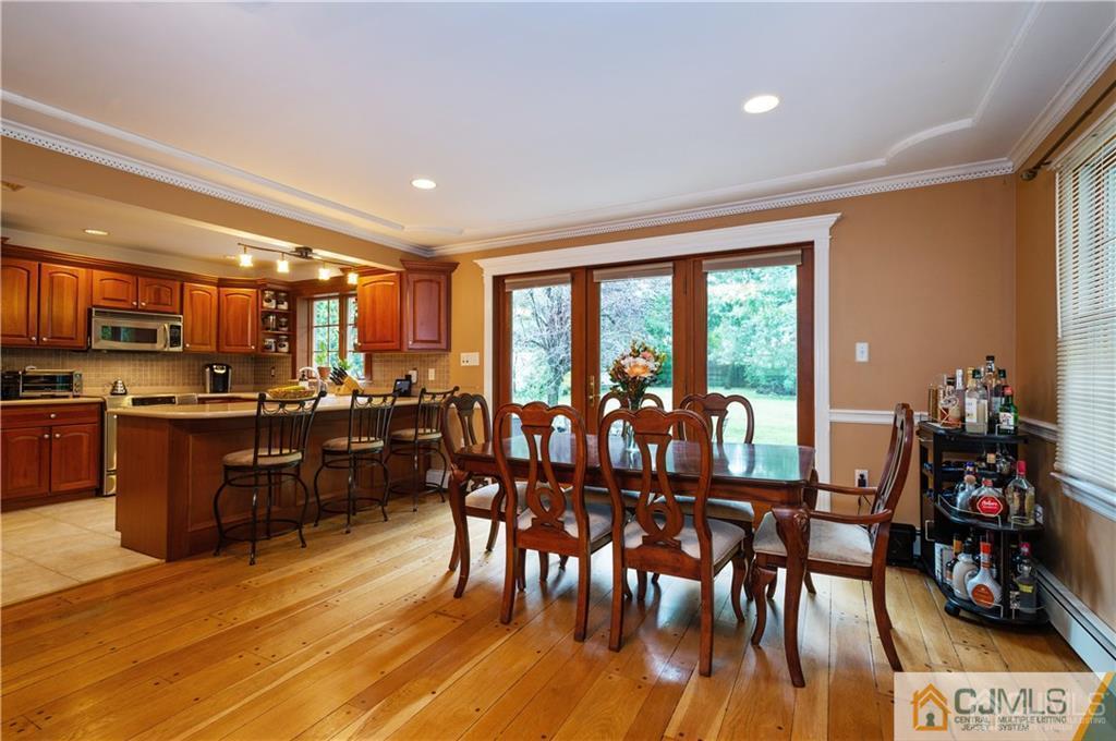 555 Chain O' Hills Road Colonia, NJ 07067 - Photo 8 of 18 a view of a dining room with furniture window and outside view