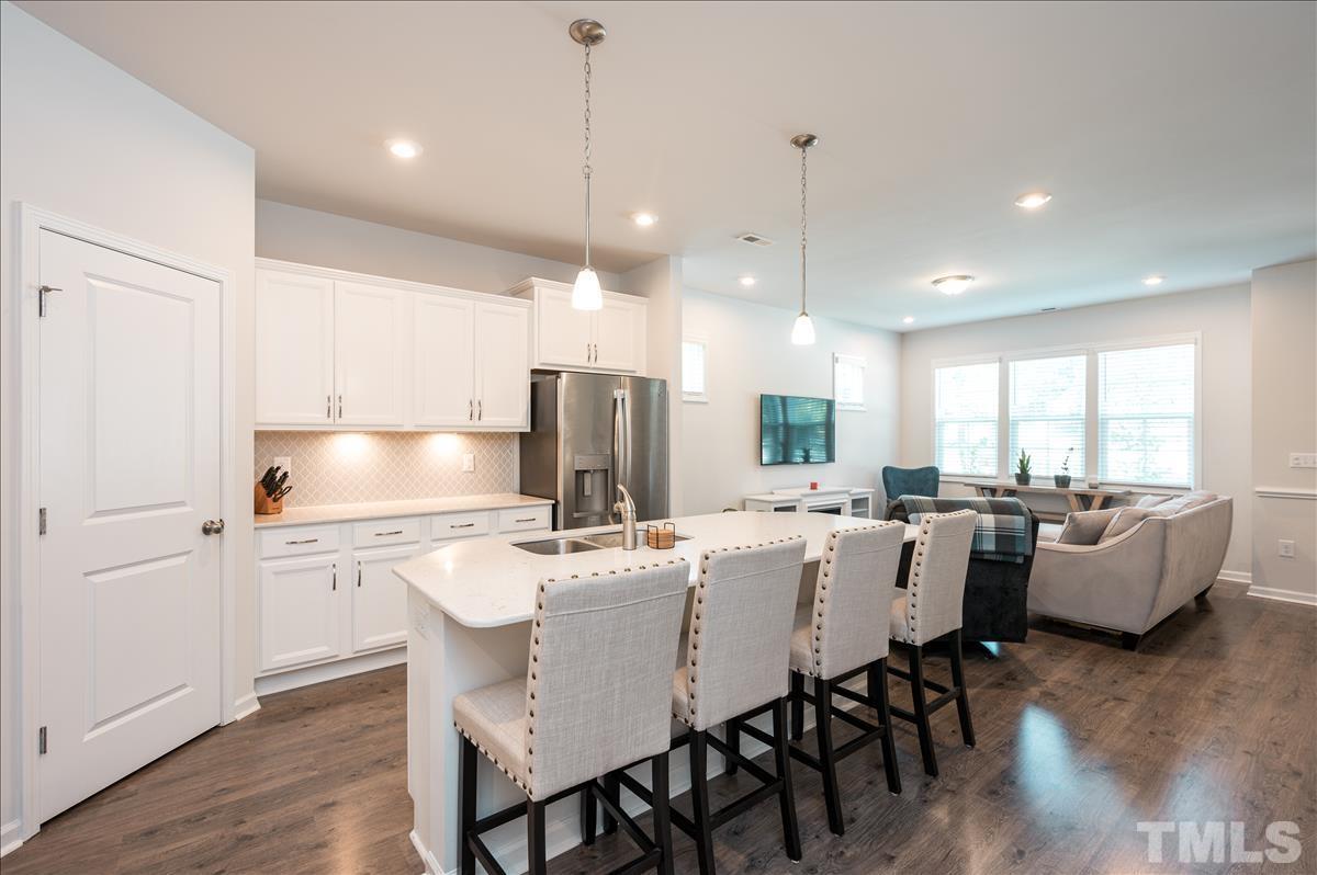 3620 Buffaloe Road Raleigh, NC 27604 - Photo 7 of 18 a large kitchen with a table and chairs