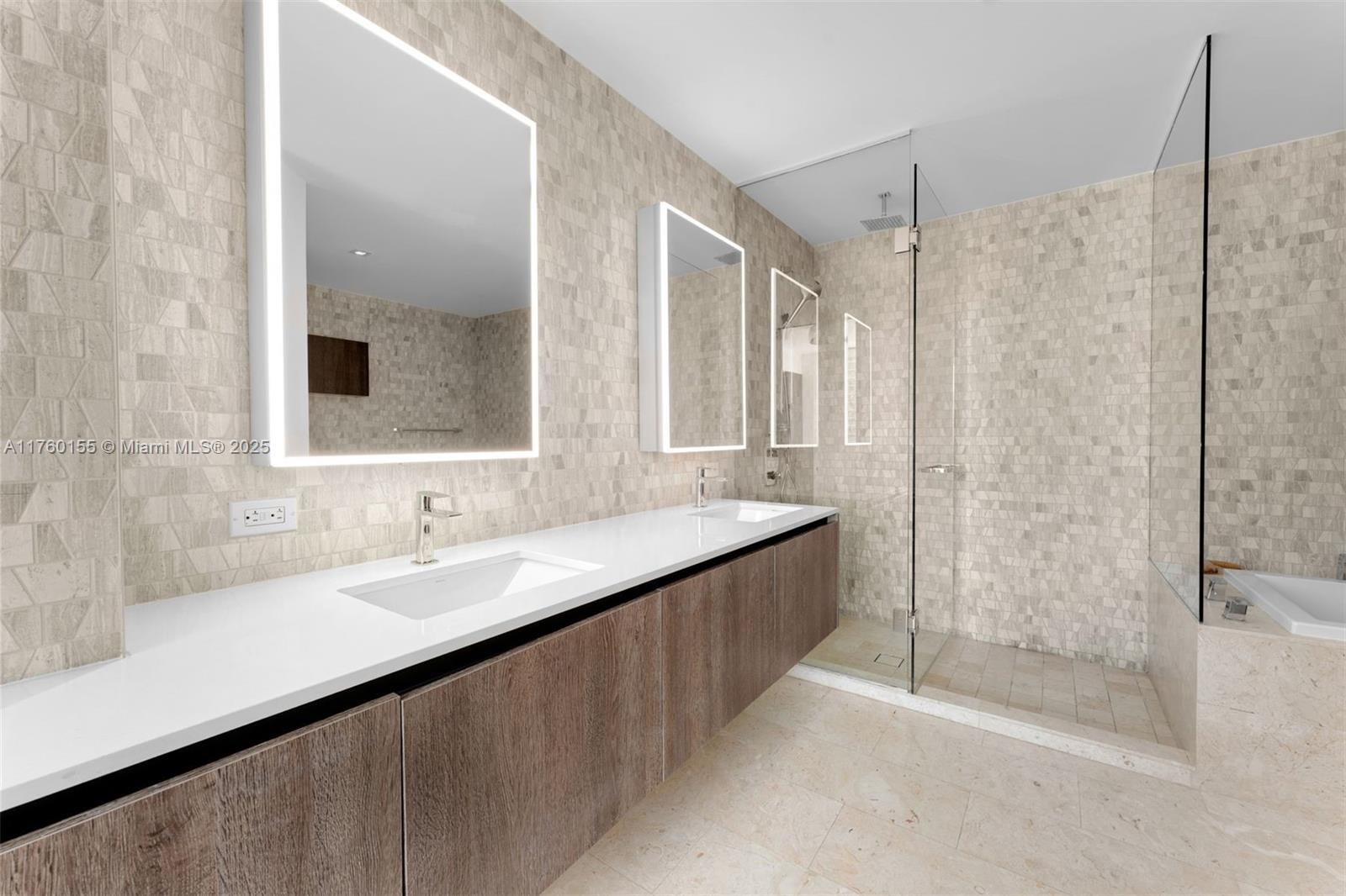 68 Southeast 6th Street, Unit 1404 Miami, FL 33131 - Photo 13 of 26 a bathroom with a double vanity sink mirror and shower