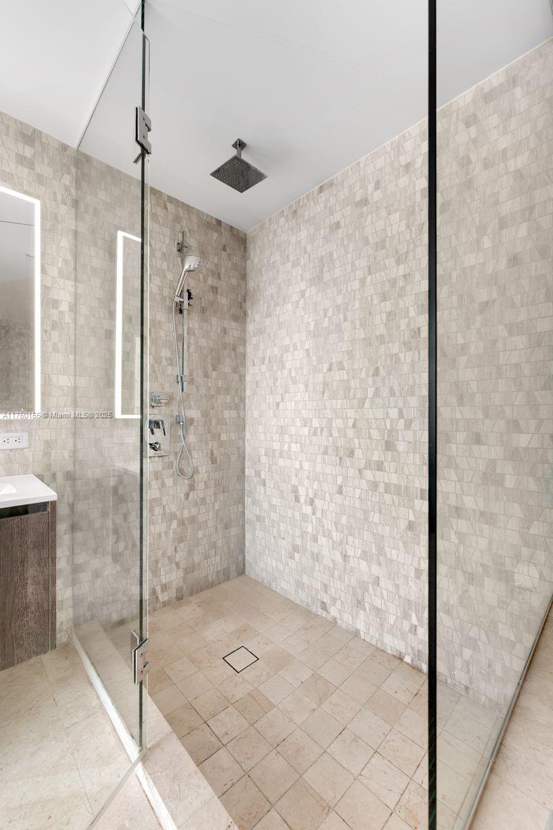 68 Southeast 6th Street, Unit 1404 Miami, FL 33131 - Photo 20 of 26 a bathroom with a shower