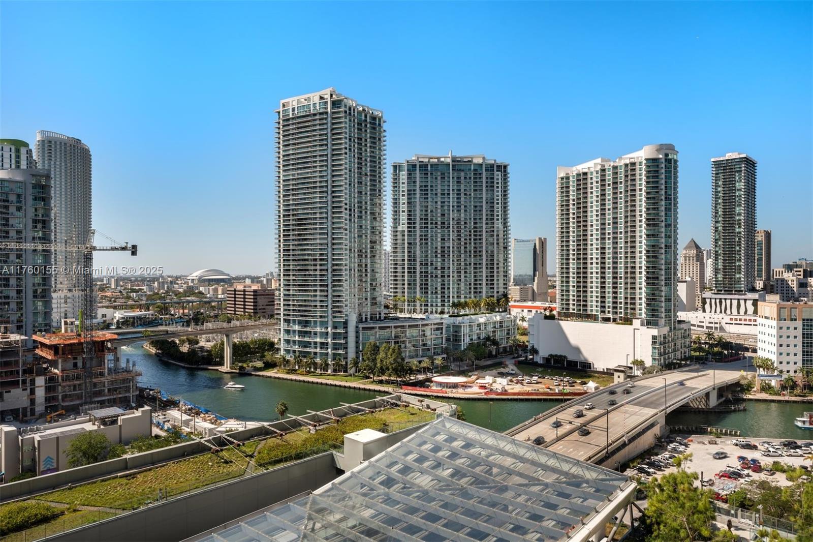 68 Southeast 6th Street, Unit 1404 Miami, FL 33131 - Photo 25 of 26 a swimming pool with outdoor seating and yard