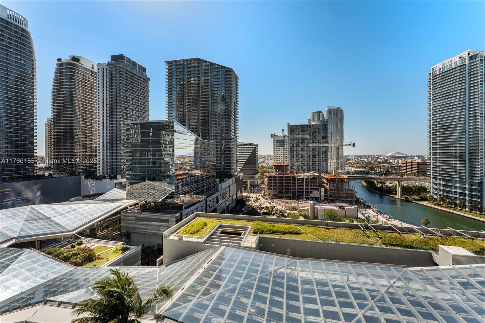68 Southeast 6th Street, Unit 1404 Miami, FL 33131 - Photo 26 of 26 a view of a swimming pool with chairs