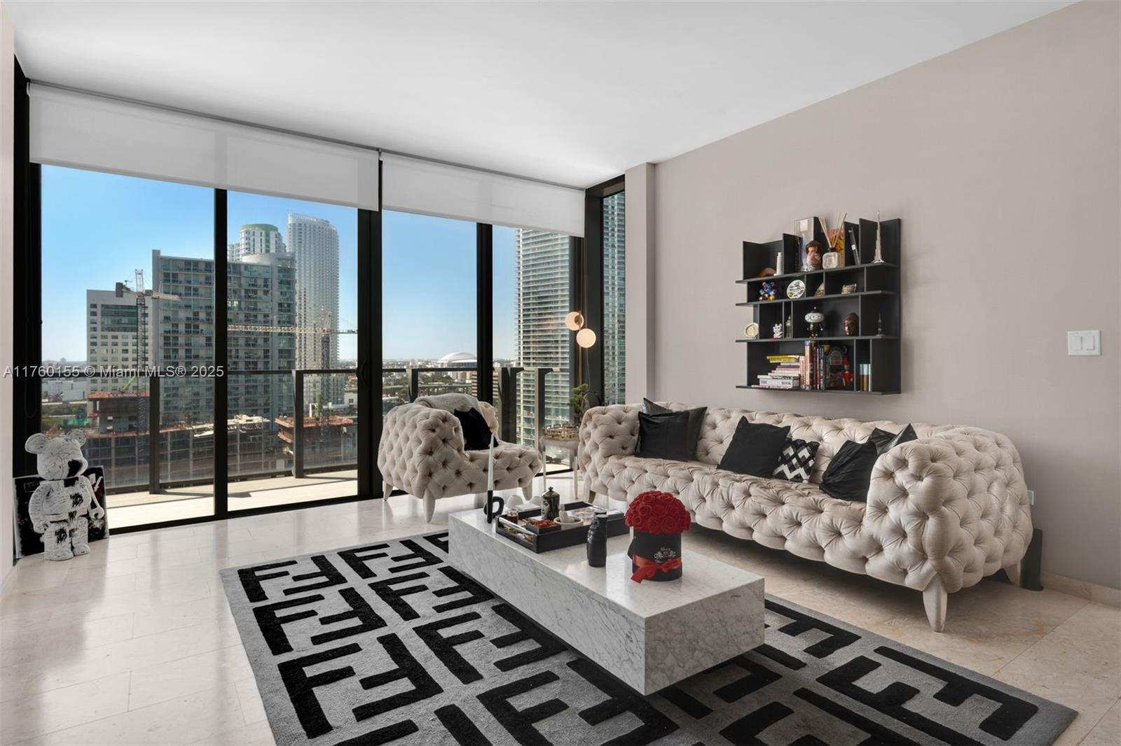 68 Southeast 6th Street, Unit 1404 Miami, FL 33131 - Photo 7 of 26 a living room with furniture and a floor to ceiling window