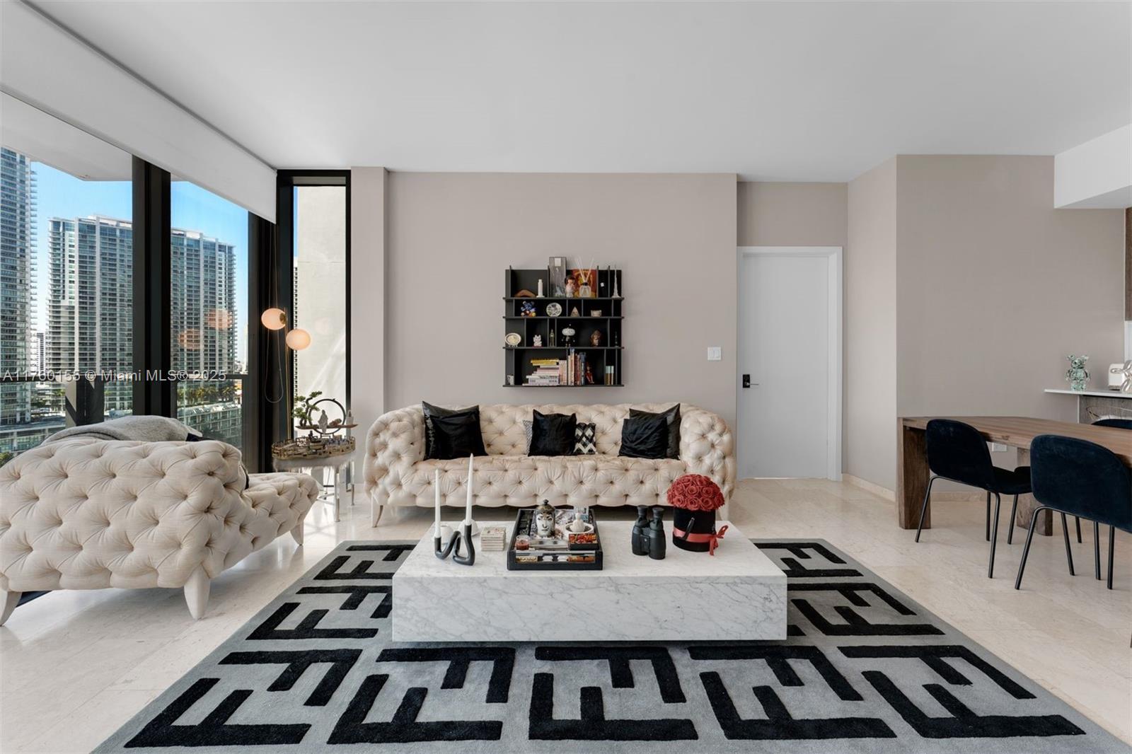 68 Southeast 6th Street, Unit 1404 Miami, FL 33131 - Photo 8 of 26 a view of a dining room with furniture