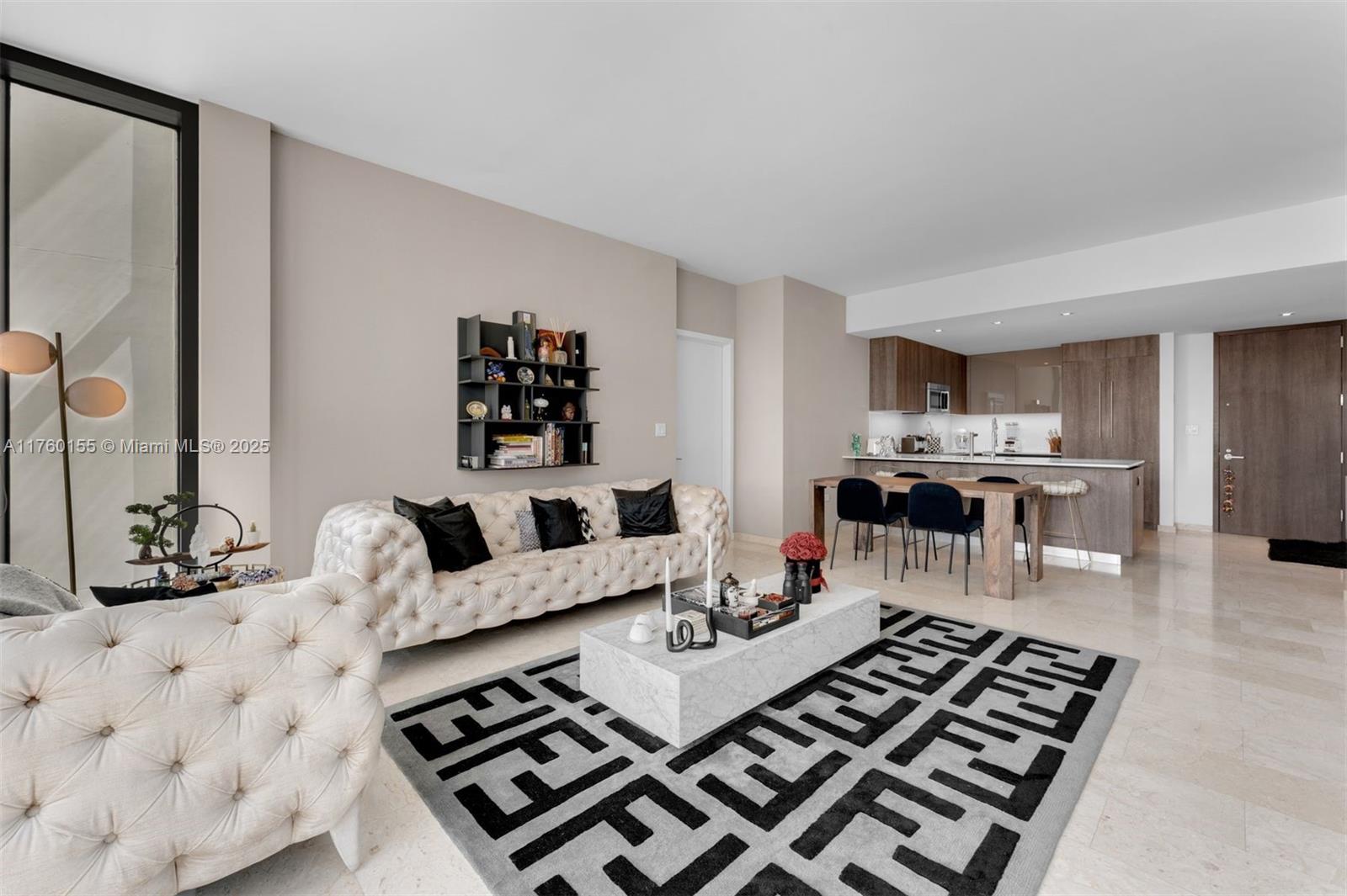 68 Southeast 6th Street, Unit 1404 Miami, FL 33131 - Photo 9 of 26 a living room with furniture and a rug