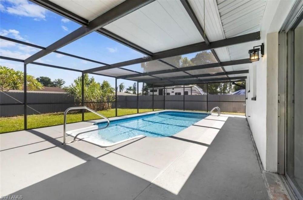 1948 46th Street Southwest Naples, FL 34116 - Photo 14 of 14 Screened swimming pool with integrated spa and deck