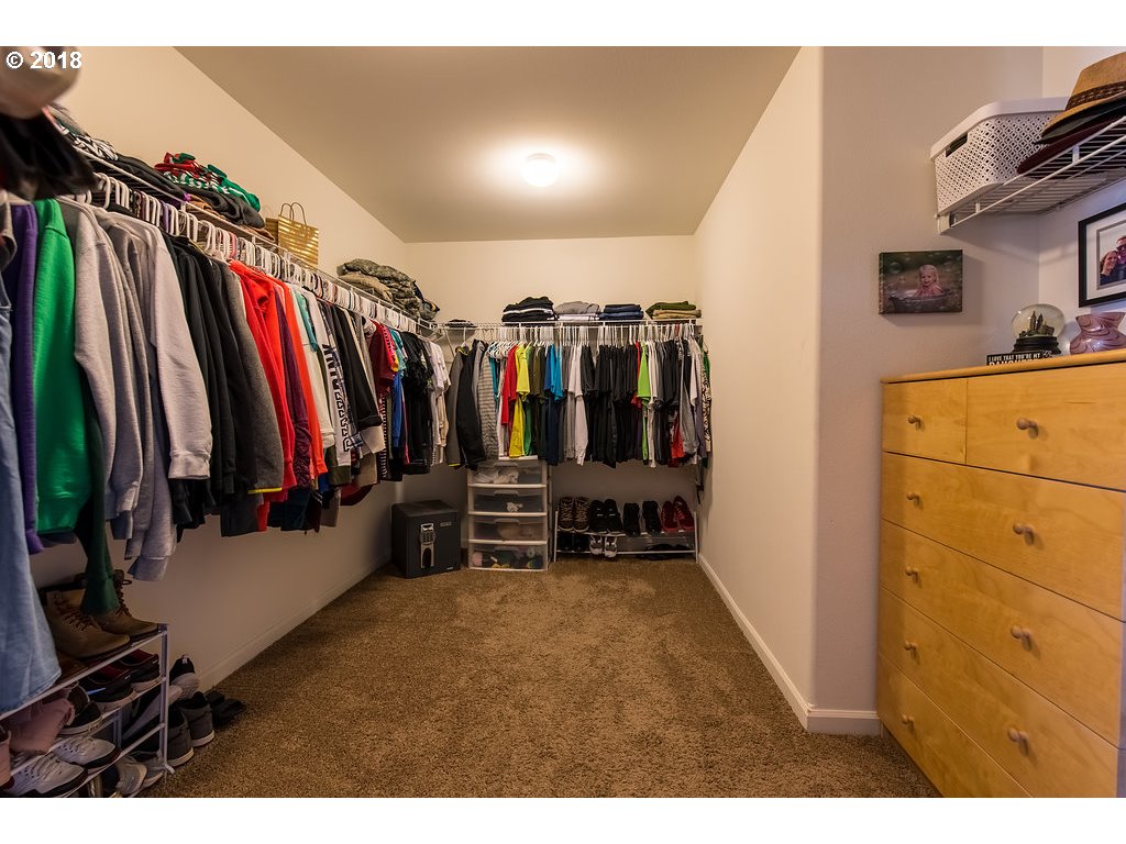 5047 Southwest 206th Place Beaverton, OR 97078 - Photo 15 of 28 a view of walk in closet with clothes and shoes