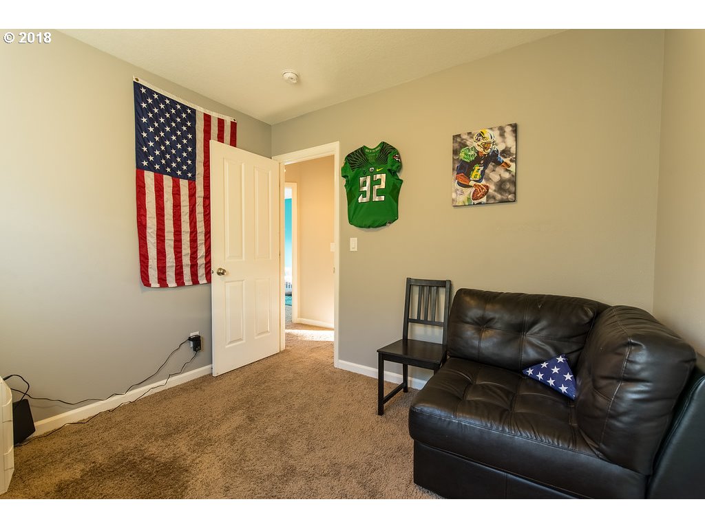 5047 Southwest 206th Place Beaverton, OR 97078 - Photo 17 of 28 a living room with furniture and a couch
