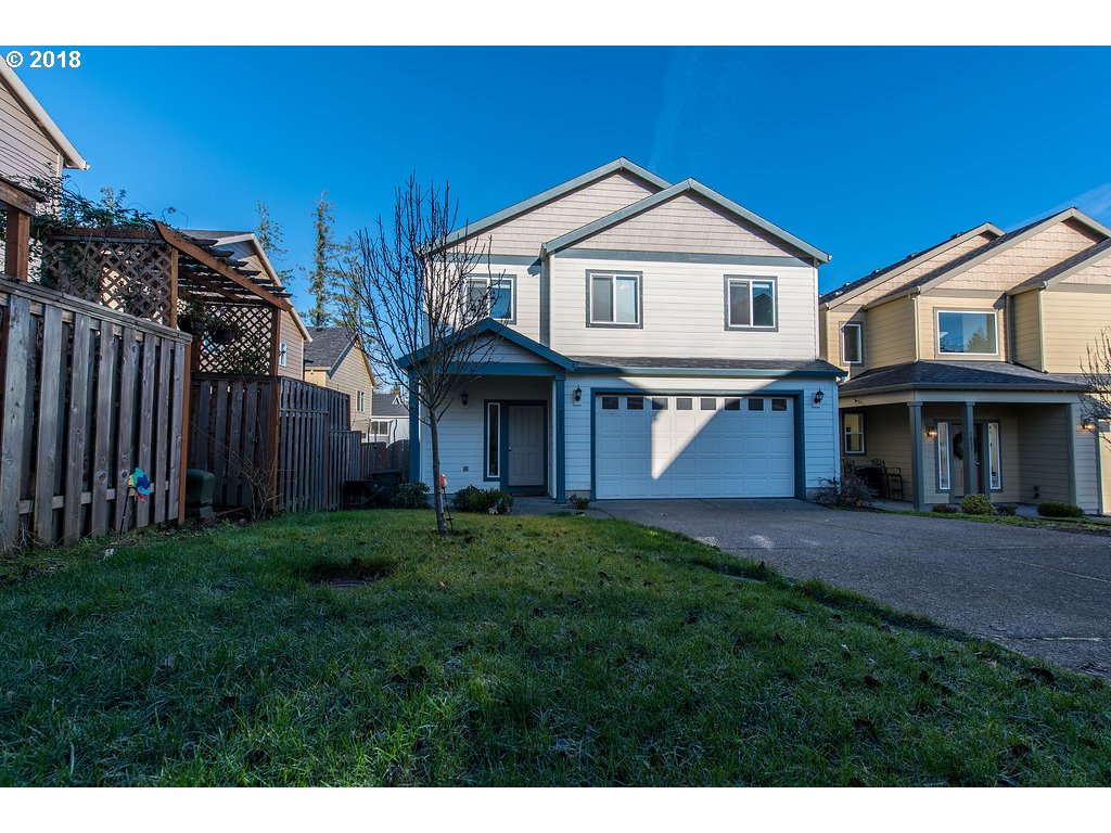 5047 Southwest 206th Place Beaverton, OR 97078 - Photo 2 of 28 a front view of a house with a yard