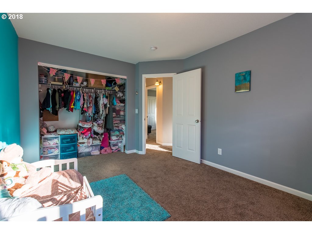 5047 Southwest 206th Place Beaverton, OR 97078 - Photo 25 of 28 a view of a livingroom with workspace and a couch