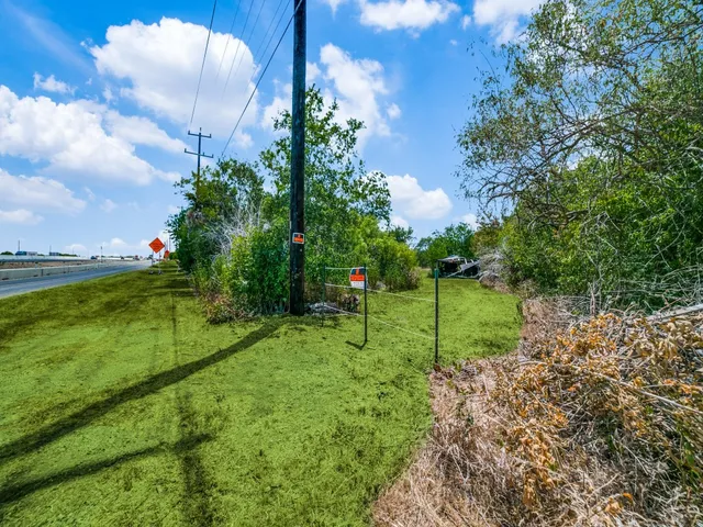 a view of a park with swings and slides