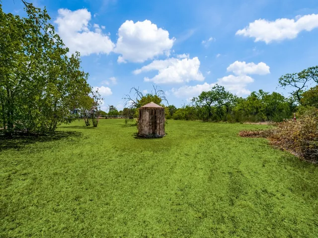 a backyard of a house with lots of green space