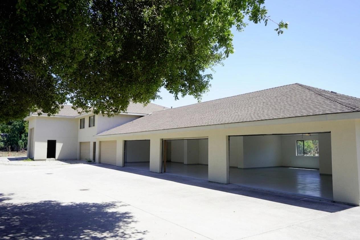 1080 Finley Road Pleasanton, CA 94588 - Photo 66 of 85 a view of a white house with a large tree