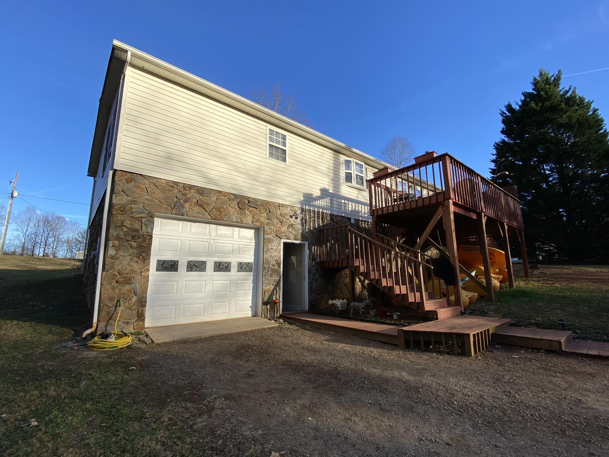 124 Salt House Branch Road Henry, VA 24102 - Photo 22 of 49 a view of a house with a yard and wooden fence