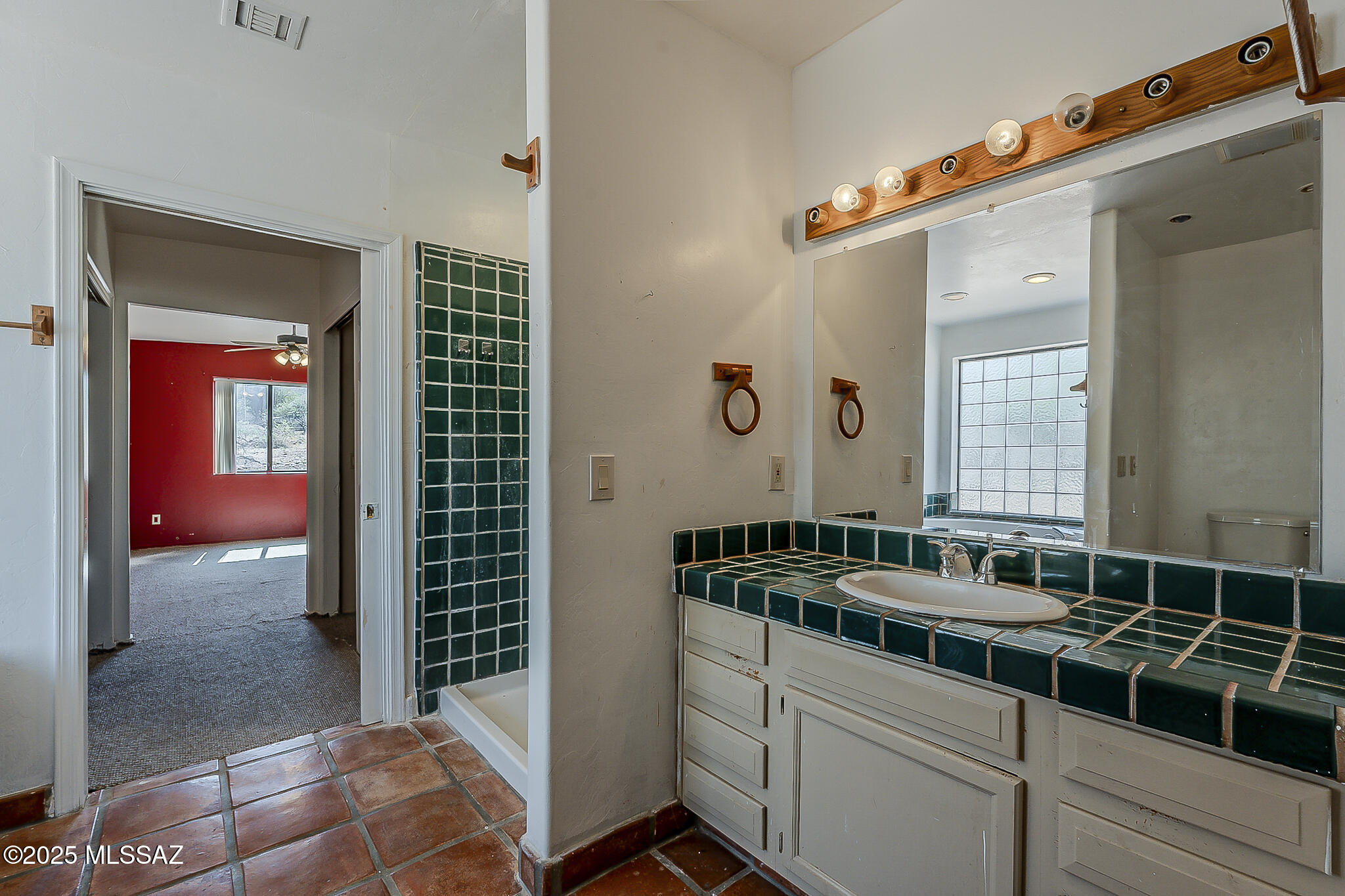 1503 Camino Bacalao Rio Rico, AZ 85648 - Photo 17 of 43 a bathroom with a sink and a mirror