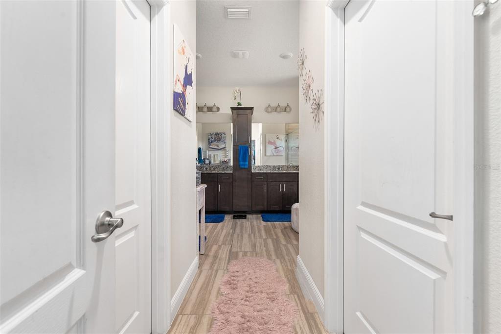 5615 Southwest 215th Terrace Newberry, FL 32669 - Photo 23 of 45 a view of a hallway with wooden floor and staircase