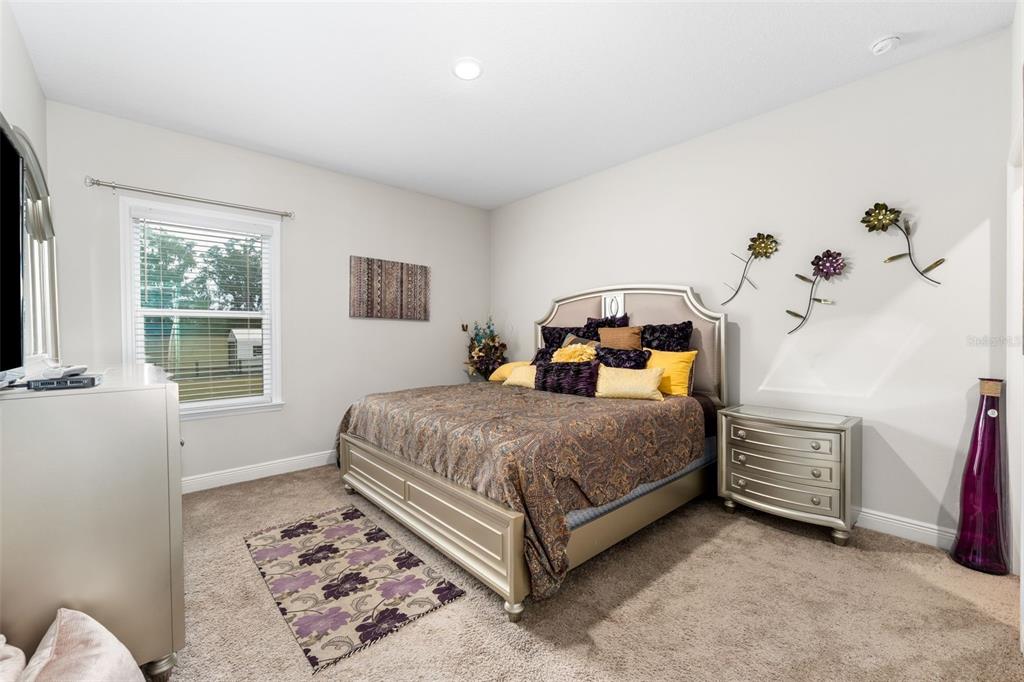 5615 Southwest 215th Terrace Newberry, FL 32669 - Photo 30 of 45 a bedroom with a bed and a window